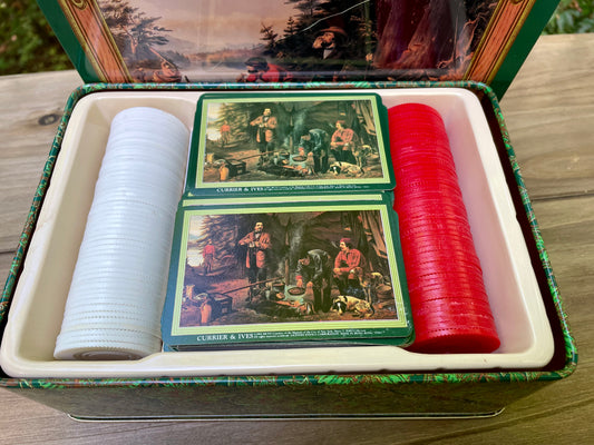 vintage playing cards, Currier and Ives collectible, poker chips set, tin box game set, 1991 card deck, Americana artwork cards, double deck poker, museum licensed vintage, retro Currier Ives tin, historical prints playing cards, camping scene poker set, hound dog canoe tin, vintage game night essentials, collectible card games, 19th century lithograph reproduction thebrokenbirdcompany vintage gift free shipping