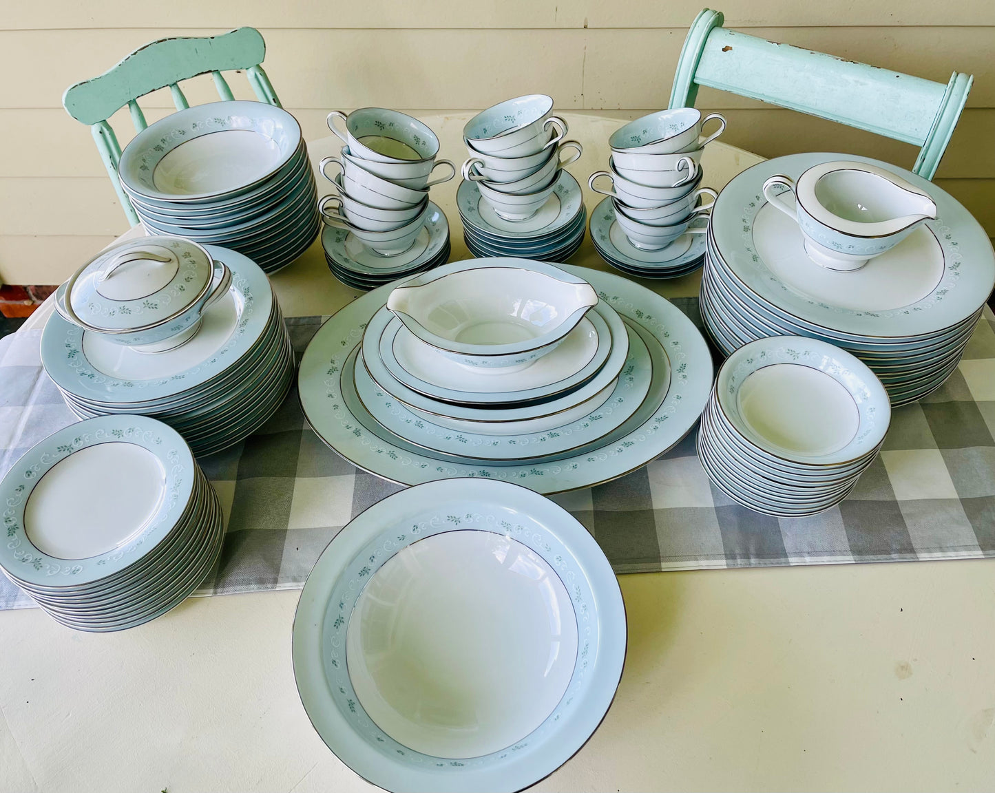 Noritake's discontinued Martha #6344 pattern, produced from 1962-1968, a military-exclusive treasure hand-painted for American families abroad, now ready to steal the show at your next porch supper or holiday feast. Includes 95 pieces (listed below) adored with baby blue trim, white filigree designs mixed with green leafy accents, topped off with a beautiful platinum rim