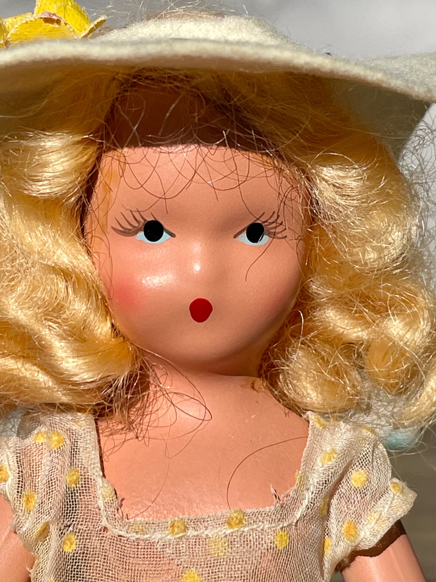 Nancy Ann storybook doll season series 91 summer doll antique collector doll yellow dress blonde hair yellow flower on hat original box frozen legs free shipping antique gift collector gift thebrokenbirdcompany christmas birthday gift for her mothers day 1940s collector doll cream colored box with blue polka dots