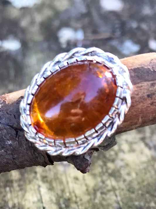 amber ring - sterling silver amber ring - oval amber ring - halo amber ring - rope halo ring - braided silver ring - natural amber inclusions - cabochon amber ring - baltic amber ring - vintage amber ring - statement amber ring - size 6 amber ring - sterling silver halo ring - boho amber jewelry - natural sediment amber cognac amber ring fossilized resin ring Thebrokenbirdcompany free shipping gift for her