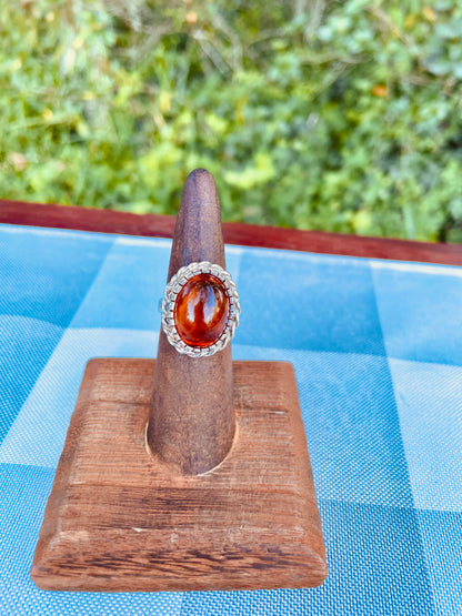 amber ring   - sterling silver amber ring   - oval amber ring   - halo amber ring   - rope halo ring   - braided silver ring   - natural amber inclusions   - cabochon amber ring   - baltic amber ring   - vintage amber ring   - statement amber ring   - size 6 amber ring   - sterling silver halo ring   - boho amber jewelry   - natural sediment amber cognac amber ring  fossilized resin ring Thebrokenbirdcompany free shipping gift for her
