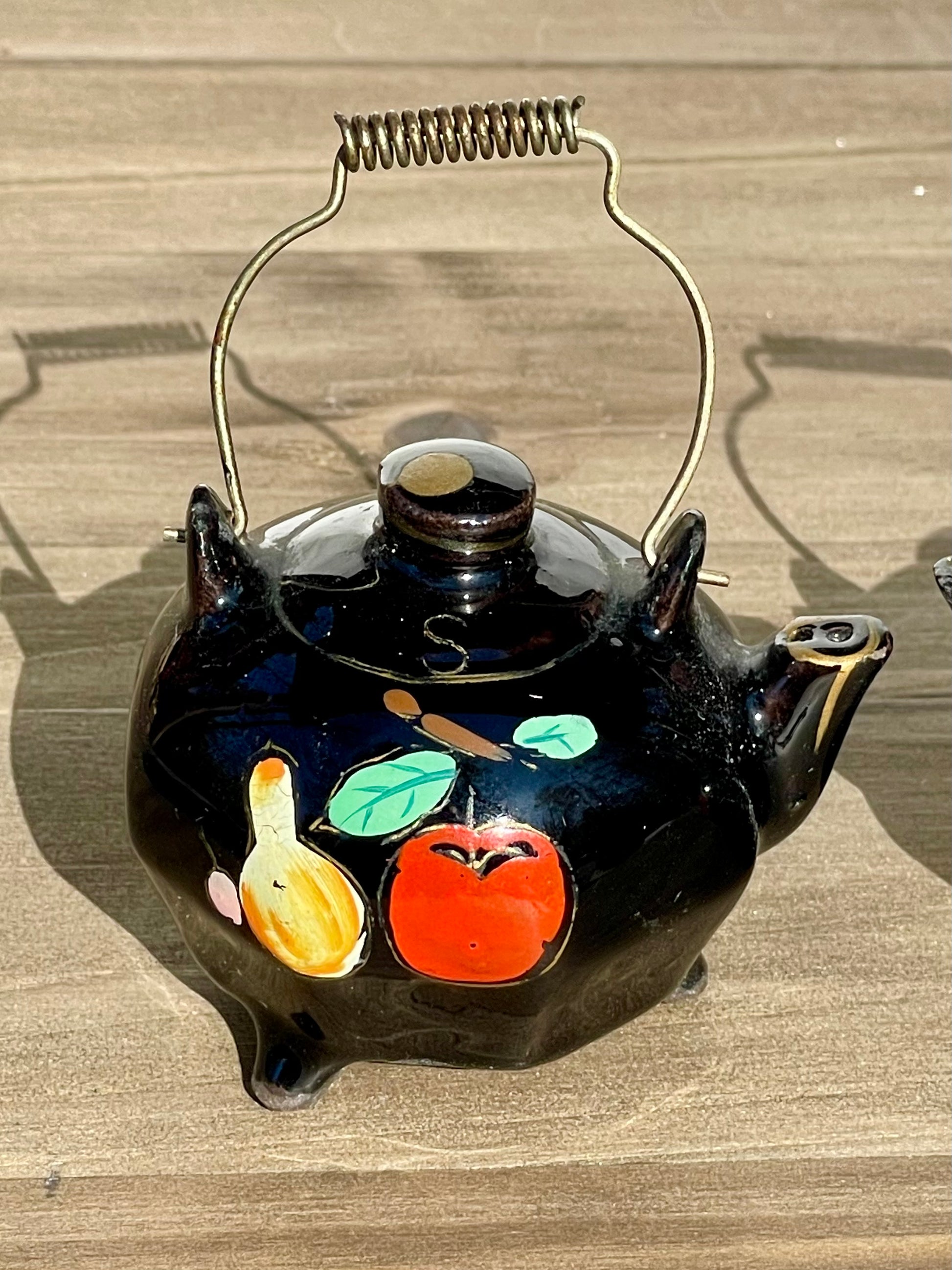 Vintage Mini Black Glazed Tea Pot Hand Painted Salt and Pepper Shakers Made in Japan Metal Wire Handles TheBrokenBird Company S&P shakers modern kitchen tea lovers