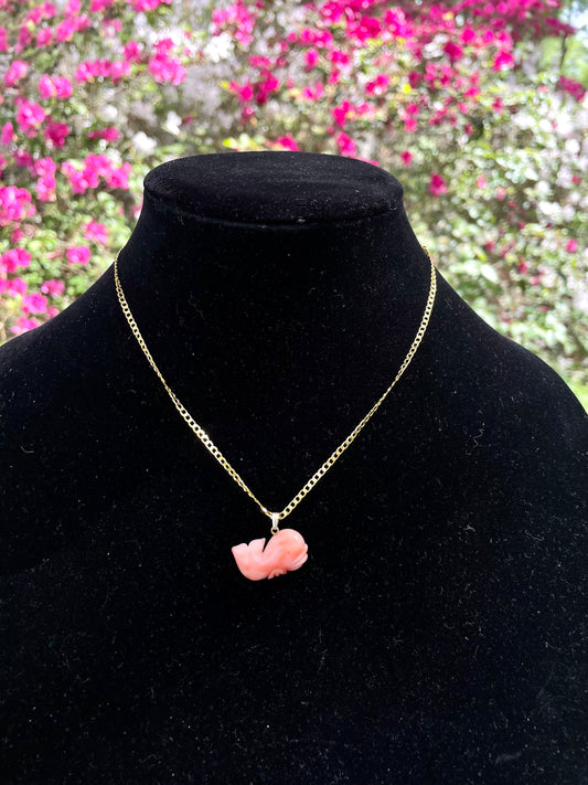 A salmon pink coral whale-shaped pendant with a gold clasp on a 16 inch gold-dipped necklace. Rare Vintage Salmon Pink Coral Whale Pendant NecklaceThebrokenbirdcompany rare coral necklace unique gift 
