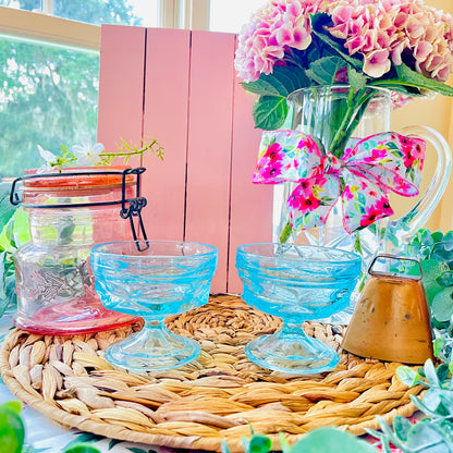 vintage king's crown thumbprint 
- indiana glass teal blue 
- king's crown thumbprint blue 
- 1970s champagne glasses 
- vintage sherbet glasses 
- teal blue coupe glasses 
- mid century glassware 
- pressed glass dessert cups 
- baby blue stemware 
- indiana glass thumbprint 
- retro barware 
- vintage blue champagne coupes  Thebrokenbirdcompany 