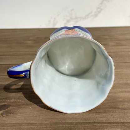 vintage sake tea cup with geisha and flowers hand painted japanese blue rimmed scalloped edge cup made in japan tall and selnder cup geisha girl in red dress red flowers gold embellishments green plants japanese landscape hand painted imagewhite porcelain scalloped base tea cup sake cup vintage gift asain inspired asain kitchen asain cup asain home decor thebrokenbirdcompany free shipping 