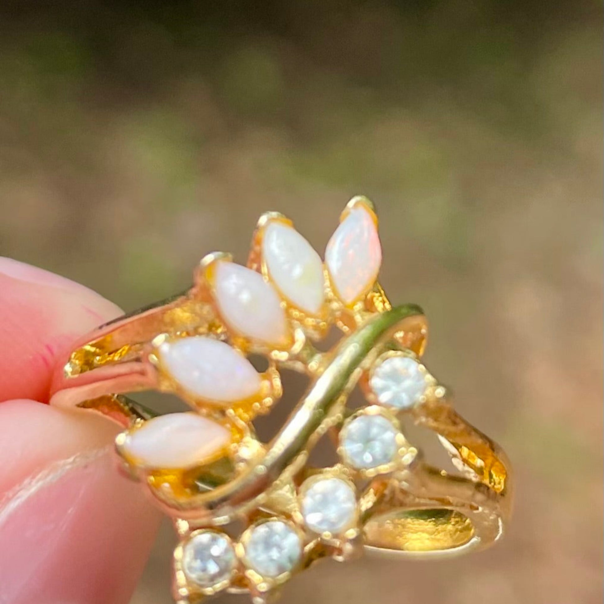 vintage_opal_and_lab_created_diamonds_on_gold_tone_ring_thebrokenbirdcompany_free_shipping_vintage_jewleryvintage opal and lab grown diamond leaf style statement ring avon vintage ring size 8.5 gift thebrokembirdcompany gift shiny ring 5 stone