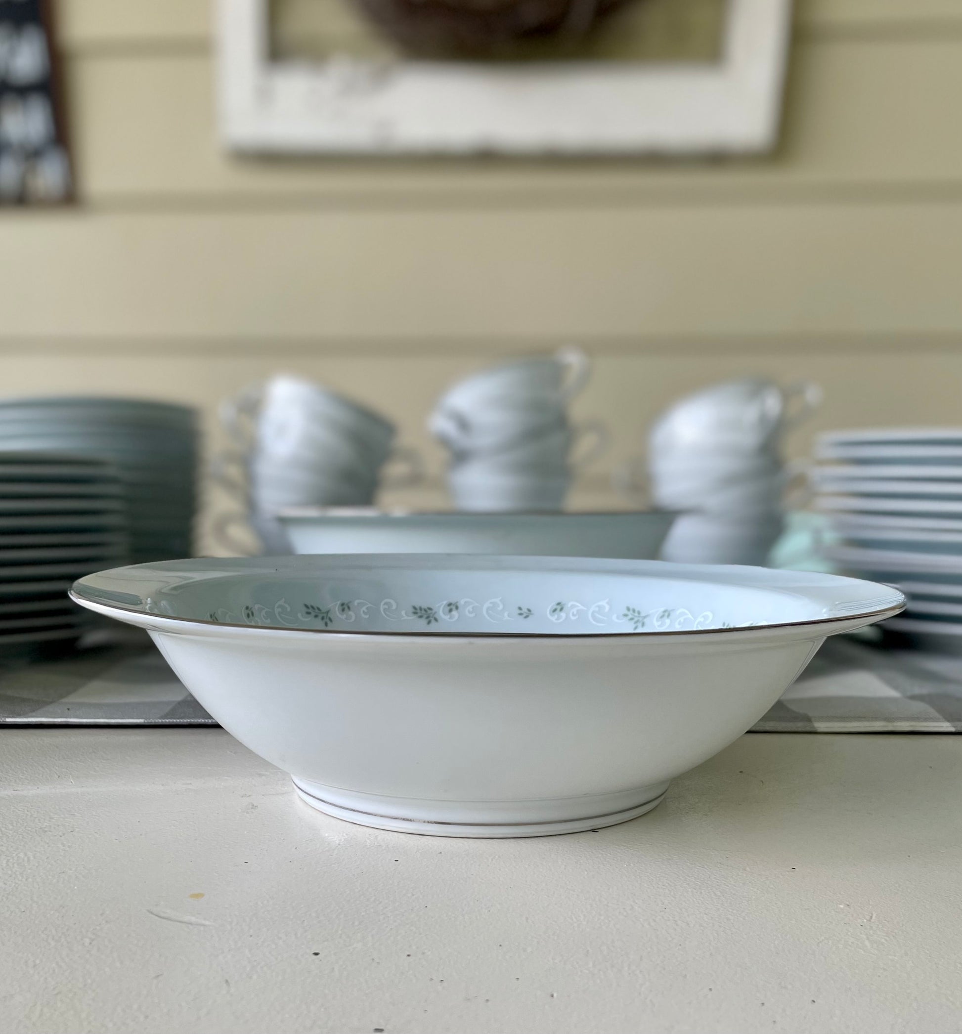Noritake's discontinued Martha #6344 pattern, produced from 1962-1968, a military-exclusive treasure hand-painted for American families abroad, now ready to steal the show at your next porch supper or holiday feast. Includes 95 pieces (listed below) adored with baby blue trim, white filigree designs mixed with green leafy accents, topped off with a beautiful platinum rim