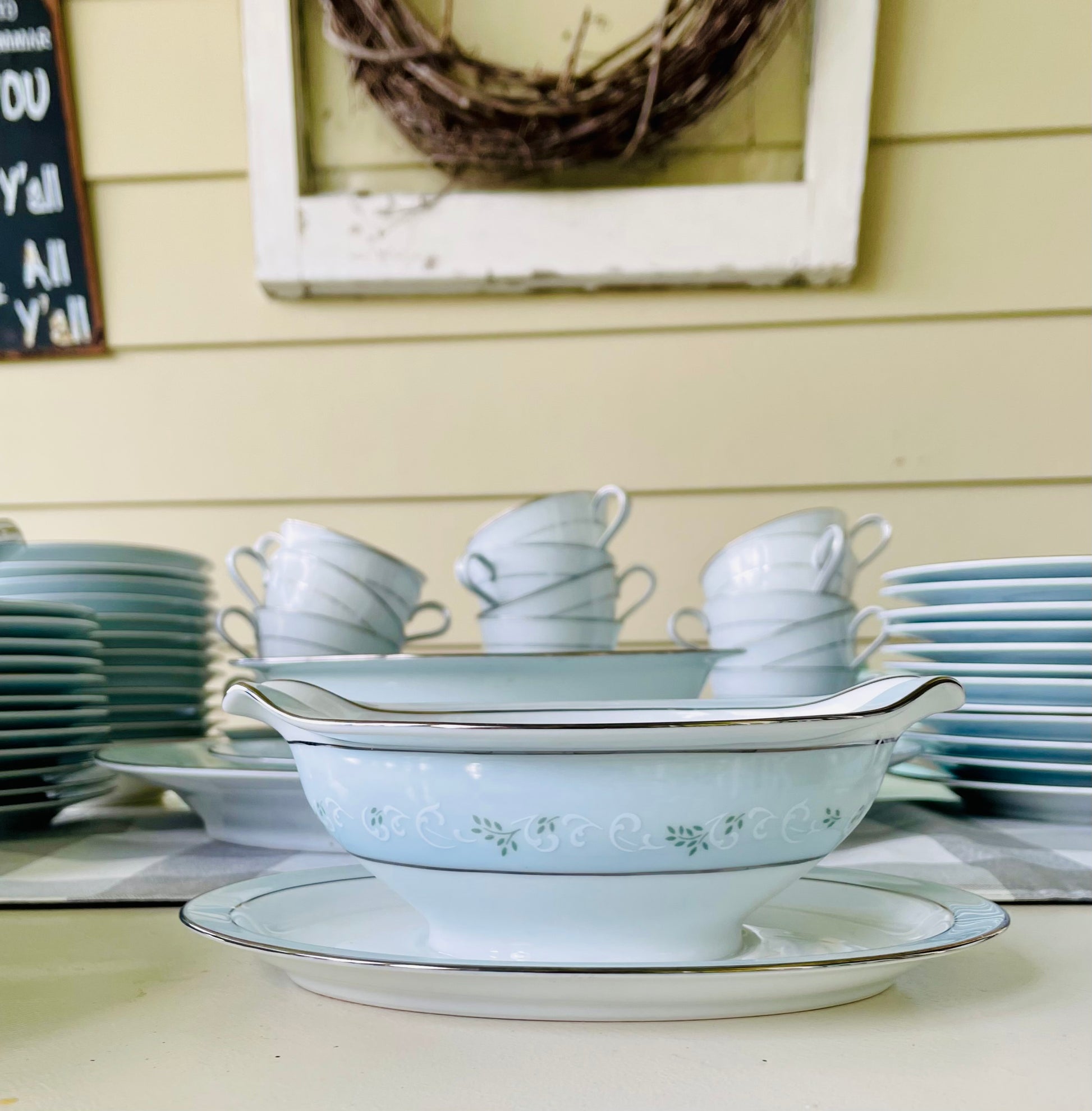 Noritake's discontinued Martha #6344 pattern, produced from 1962-1968, a military-exclusive treasure hand-painted for American families abroad, now ready to steal the show at your next porch supper or holiday feast. Includes 95 pieces (listed below) adored with baby blue trim, white filigree designs mixed with green leafy accents, topped off with a beautiful platinum rim