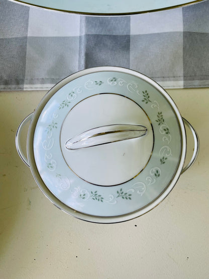 Noritake's discontinued Martha #6344 pattern, produced from 1962-1968, a military-exclusive treasure hand-painted for American families abroad, now ready to steal the show at your next porch supper or holiday feast. Includes 95 pieces (listed below) adored with baby blue trim, white filigree designs mixed with green leafy accents, topped off with a beautiful platinum rim