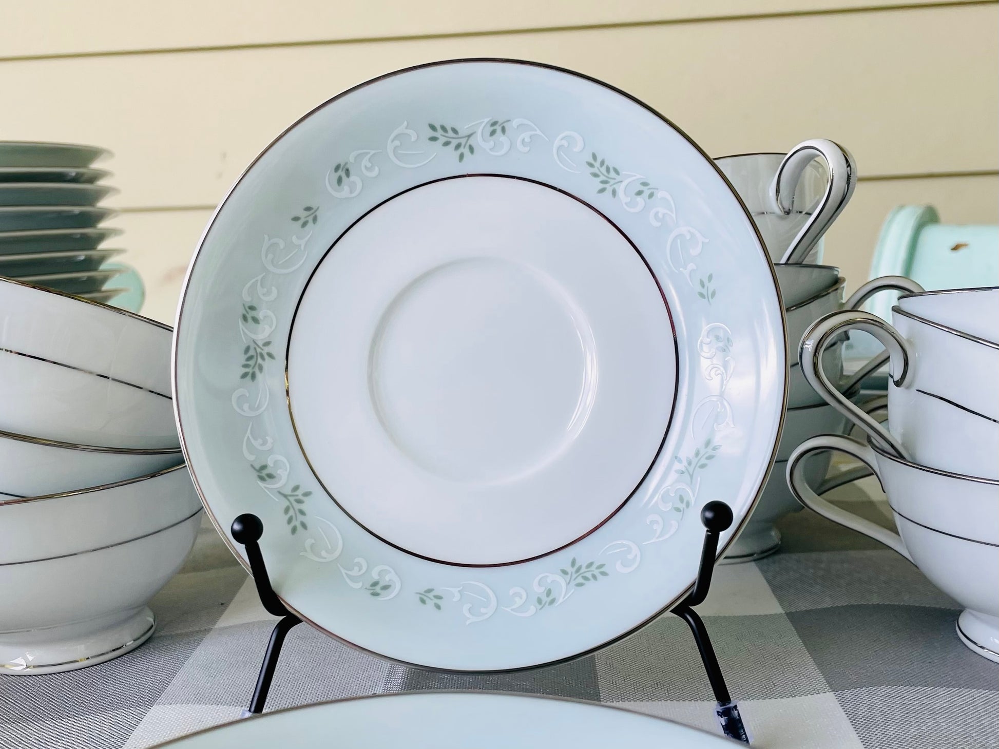 Noritake's discontinued Martha #6344 pattern, produced from 1962-1968, a military-exclusive treasure hand-painted for American families abroad, now ready to steal the show at your next porch supper or holiday feast. Includes 95 pieces (listed below) adored with baby blue trim, white filigree designs mixed with green leafy accents, topped off with a beautiful platinum rim