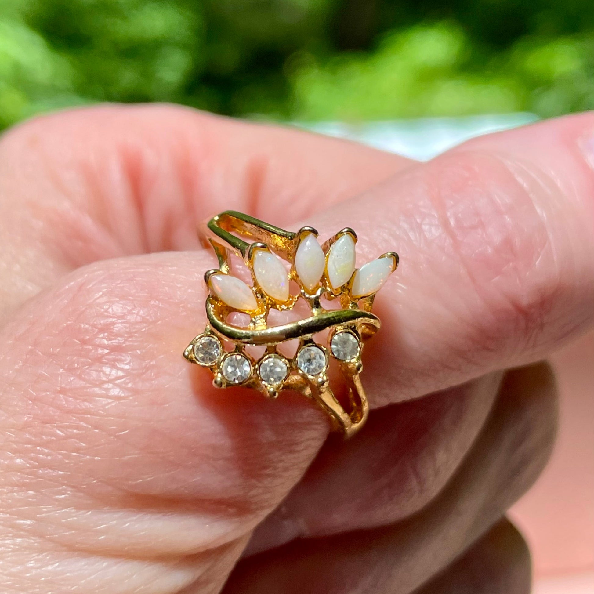 vintage_opal_and_lab_created_diamonds_on_gold_tone_ring_thebrokenbirdcompany_free_shipping_vintage_jewleryvintage opal and lab grown diamond leaf style statement ring avon vintage ring size 8.5 gift thebrokembirdcompany gift shiny ring 5 stone