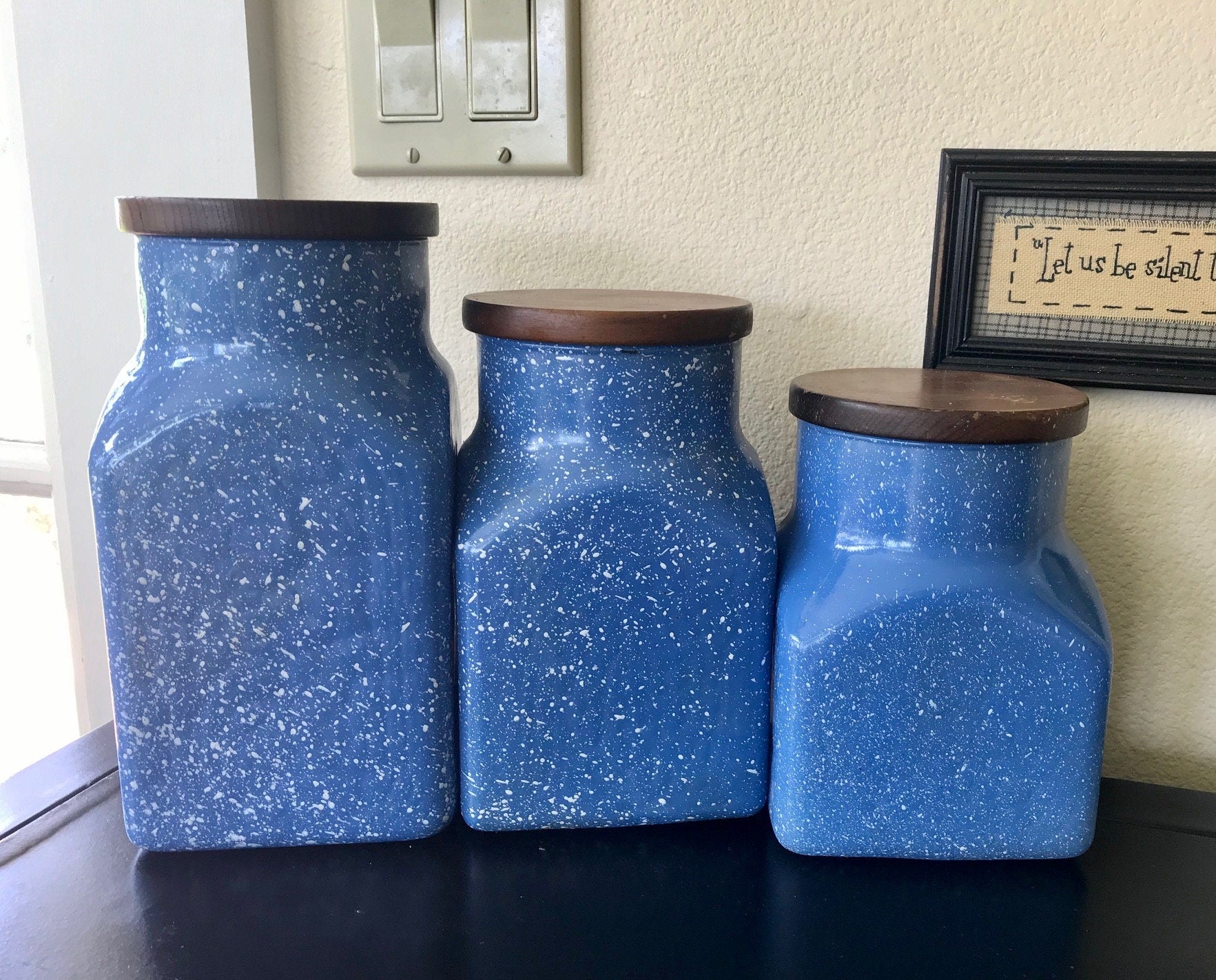 blue speckled canisters, ceramic canister set, farmhouse kitchen decor, kitchen storage jars, wooden lid canisters, set of 3 canisters, rustic kitchen storage, blue kitchen canisters, speckled ceramic jars, cottagecore kitchen, coastal farmhouse decor, countertop storage, vintage style canisters, blue and white kitchen jars, farmhouse canisters, ceramic storage set Thebrokenbirdcompany free shipping