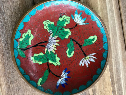 Beautiful rare antique Chinese Cloisonné red enamel on bronze plate with intricate etching lotus flowers and geometric shape trim in turquoise or Jingtai blue with geometric design in red. Lotus flowers in Chinese art represent purity, enlightenment and rebirth in Buddhist iconography. This is extremely rare piece due to the CHINA stamping on the back and the A being a triangle. Most likely from 1912-1949.