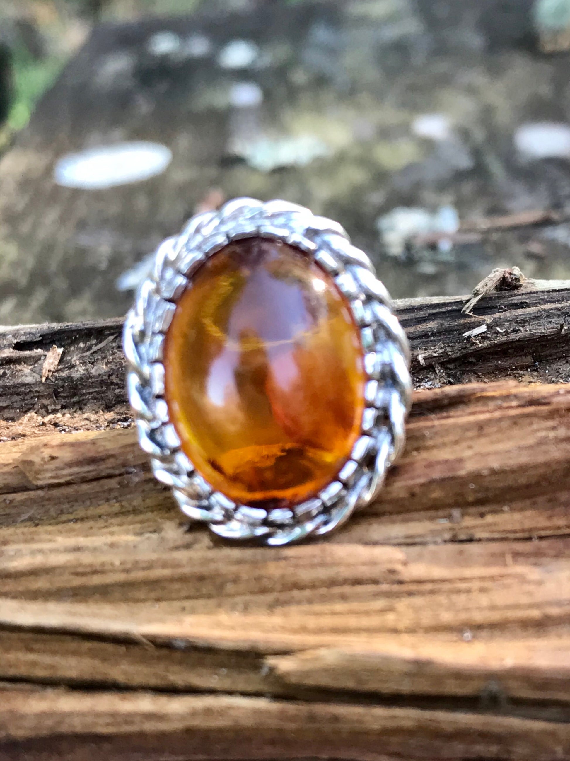 amber ring   - sterling silver amber ring   - oval amber ring   - halo amber ring   - rope halo ring   - braided silver ring   - natural amber inclusions   - cabochon amber ring   - baltic amber ring   - vintage amber ring   - statement amber ring   - size 6 amber ring   - sterling silver halo ring   - boho amber jewelry   - natural sediment amber cognac amber ring  fossilized resin ring Thebrokenbirdcompany free shipping gift for her