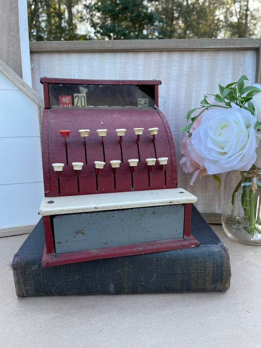 Vintage toy cash register
Tom Thumb cash register
950s tin toy
Retro cash register
Metal toy cash register
Antique toy register
Collectible tin toys
Western Stamping Co toy
Mechanical cash register toy
Red tin cash register
Nostalgic kids toy
Vintage play money register
Mid-century toy
Tinplate cash register
Childrens vintage toy
Retro store play set
Antique metal toy
50s era cash register Collectible childrens register Maroon toy cash register thebrokenbirdcompany gift for collector